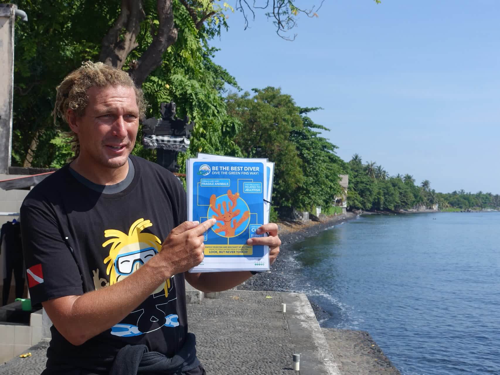 Nico protects and respects the ocean by explaining environmental guidelines during his pre-dive briefings